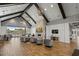 Inviting lounge area with high ceilings, exposed beams, a fireplace, and comfortable seating at 7374 Sarteano Dr., Myrtle Beach, SC 29572