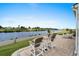 Outdoor patio with lake views, lounge chairs, and a fire pit, creating an inviting entertaining space at 7374 Sarteano Dr., Myrtle Beach, SC 29572