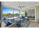 Screened-in porch featuring comfortable seating and a beautiful view of the lake at 7374 Sarteano Dr., Myrtle Beach, SC 29572