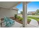 Inviting front porch with blue Adirondack chairs at 7374 Sarteano Dr., Myrtle Beach, SC 29572