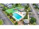 Aerial view showcasing the community pool, tennis courts, and clubhouse at 775 Plantation Dr. # 53, Little River, SC 29566
