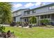 Backyard with covered patio, barbecue grill and lush green lawn at 775 Plantation Dr. # 53, Little River, SC 29566