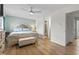 Bedroom with an upholstered bed, ensuite bathroom, and lots of natural light from the windows at 775 Plantation Dr. # 53, Little River, SC 29566