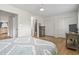 Bedroom boasts two closets, light colored wood flooring, a ceiling fan, and lots of natural light at 775 Plantation Dr. # 53, Little River, SC 29566