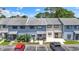 Charming townhome featuring a light-blue facade, a cozy patio, and well-manicured landscaping at 775 Plantation Dr. # 53, Little River, SC 29566