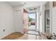 Bright foyer featuring hardwood floors, a striking red front door, and a modern stainless steel refrigerator at 775 Plantation Dr. # 53, Little River, SC 29566