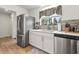 Modern kitchen featuring stainless steel appliances, sleek countertops, and ample storage space at 775 Plantation Dr. # 53, Little River, SC 29566
