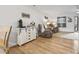 Comfortable living room with hardwood floors, neutral-toned furniture, and ample natural light at 775 Plantation Dr. # 53, Little River, SC 29566