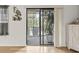 Sliding glass doors open to outdoor patio with large potted plant bringing the outdoors in at 775 Plantation Dr. # 53, Little River, SC 29566