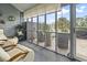Charming screened-in patio offers a peaceful retreat with ample seating and views of the surrounding landscape at 775 Plantation Dr. # 53, Little River, SC 29566