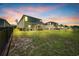 The fenced-in backyard has a lush lawn, perfect for outdoor entertaining and recreation at 788 Dusty Pine Way, Myrtle Beach, SC 29588