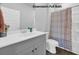 Bathroom featuring a gray vanity, white toilet, and shower-tub combination at 788 Dusty Pine Way, Myrtle Beach, SC 29588