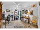 Well-lit home office with multiple desks, shelving, and a comfortable chair, perfect for productivity at 788 Dusty Pine Way, Myrtle Beach, SC 29588
