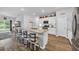 The kitchen has a large granite island with seating, perfect for casual dining and entertaining at 788 Dusty Pine Way, Myrtle Beach, SC 29588