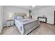 Serene primary bedroom with a wooden bed frame, soft lighting, and a calming color scheme at 788 Dusty Pine Way, Myrtle Beach, SC 29588