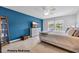 Bright primary bedroom with a cozy bed, dresser, and ample natural light from the windows at 788 Dusty Pine Way, Myrtle Beach, SC 29588