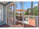 Relaxing screened back porch overlooking the deck and backyard at 890 Knoll Dr., Little River, SC 29566