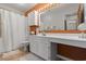 Bathroom with white vanity and orange accent wall at 890 Knoll Dr., Little River, SC 29566