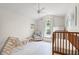 Bright Bedroom with vaulted ceiling, wood crib, white furniture and a ceiling fan at 890 Knoll Dr., Little River, SC 29566