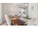 Dining room featuring a wooden table with 6 chairs and modern chandelier at 890 Knoll Dr., Little River, SC 29566