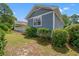 Angled backyard view of home exterior with siding and back deck at 890 Knoll Dr., Little River, SC 29566