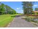 Fairway view of golf course with paved path and homes on the right at 890 Knoll Dr., Little River, SC 29566