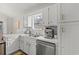 Modern kitchen featuring stainless appliances, white cabinets, and subway tile backsplash at 890 Knoll Dr., Little River, SC 29566