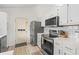 Kitchen featuring stainless steel appliances, white subway tile, and modern cabinets at 890 Knoll Dr., Little River, SC 29566