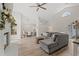 Open-concept living room with fireplace, mantel, and large TV, seamlessly connected to the dining area at 890 Knoll Dr., Little River, SC 29566