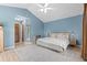 Spacious main bedroom offering soft blue walls and high vaulted ceilings at 890 Knoll Dr., Little River, SC 29566