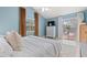 Bright main bedroom featuring a slider to deck and large windows at 890 Knoll Dr., Little River, SC 29566