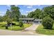 Charming single-story home with mature trees, front lawn, and a 'For Sale' sign at 903 N Park St. Ext., Mullins, SC 29574