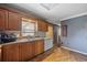 A kitchen featuring wood cabinets, double basin sink, and some appliances at 903 N Park St. Ext., Mullins, SC 29574