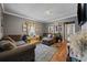 Comfortable living room with a sectional sofa, area rug, and natural light at 903 N Park St. Ext., Mullins, SC 29574