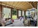 A sunroom with many windows and unfinished walls at 903 N Park St. Ext., Mullins, SC 29574