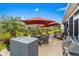 Outdoor patio with a dining area, lounge seating, and well-manicured landscaping at 908 Ashbourn Ct., Murrells Inlet, SC 29576