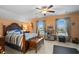 Spacious bedroom with a decorative bed frame, curtains, and a ceiling fan at 908 Ashbourn Ct., Murrells Inlet, SC 29576