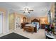 Bedroom featuring an ornate bed frame, a ceiling fan, and a connected bathroom for added convenience at 908 Ashbourn Ct., Murrells Inlet, SC 29576