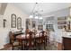 Elegant dining room featuring a wooden table, decorative lighting, and stylish decor at 908 Ashbourn Ct., Murrells Inlet, SC 29576