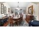 Elegant dining room featuring a classic dining set, tasteful decor, and ample natural light at 908 Ashbourn Ct., Murrells Inlet, SC 29576