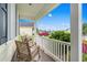 Cozy front porch seating featuring rocking chairs, a view of the neighborhood, and ample natural light at 908 Ashbourn Ct., Murrells Inlet, SC 29576