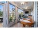 Bright sunroom filled with natural light, offering a relaxing seating area at 908 Ashbourn Ct., Murrells Inlet, SC 29576