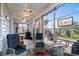 Inviting sunroom with wicker furniture and scenic outdoor views at 908 Ashbourn Ct., Murrells Inlet, SC 29576