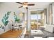 Open-concept living and dining area featuring a charming table, comfortable seating, and sliding glass doors to the balcony at 9400 Shore Dr. # 409, Myrtle Beach, SC 29572