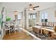 Bright living room featuring a dining area, comfortable seating, a ceiling fan, and sliding doors to a balcony at 9400 Shore Dr. # 409, Myrtle Beach, SC 29572