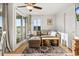 Inviting living room with comfortable seating, decorative rug, balcony access, and sun-filled windows with a view at 9400 Shore Dr. # 409, Myrtle Beach, SC 29572