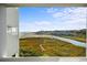 Scenic view from a balcony showcasing marshland, ocean, and a serene blue sky at 9400 Shore Dr. # 409, Myrtle Beach, SC 29572