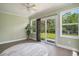 Bedroom with ceiling fan, views of the backyard and pond, and a round area rug at 946 Wyndfall Dr., Sunset Beach, NC 28468