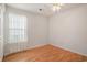 Bedroom featuring wood floors, a ceiling fan, and a window with sheer curtains at 946 Wyndfall Dr., Sunset Beach, NC 28468
