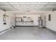 Spacious garage with plenty of storage, utility door, and a water heater at 946 Wyndfall Dr., Sunset Beach, NC 28468